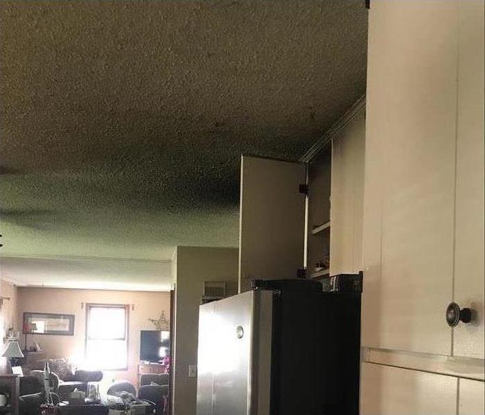 soot damaged ceiling in home