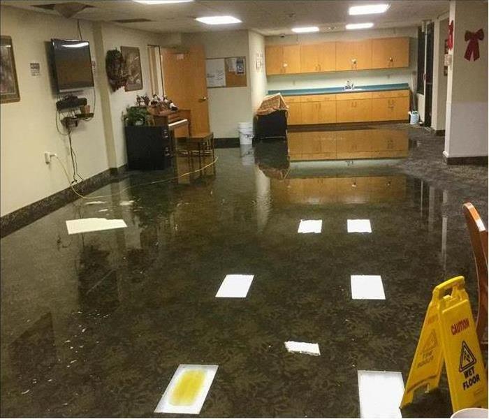 standing water in lobby of office building 