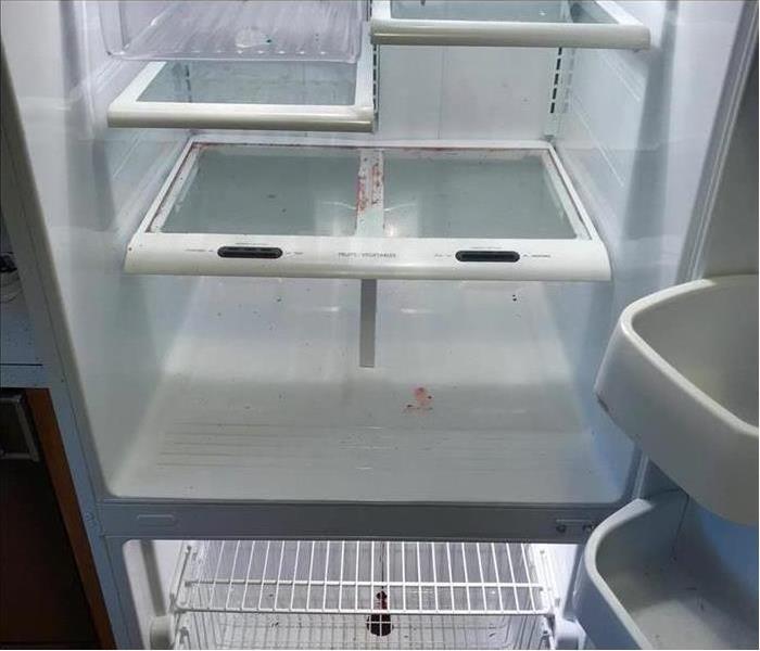 fridge with spills and messes
