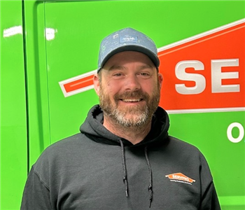 man standing in front of servpro van