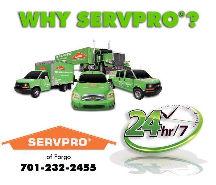 SERVPRO trucks and vans and a SERVPRO 24/7 sign.