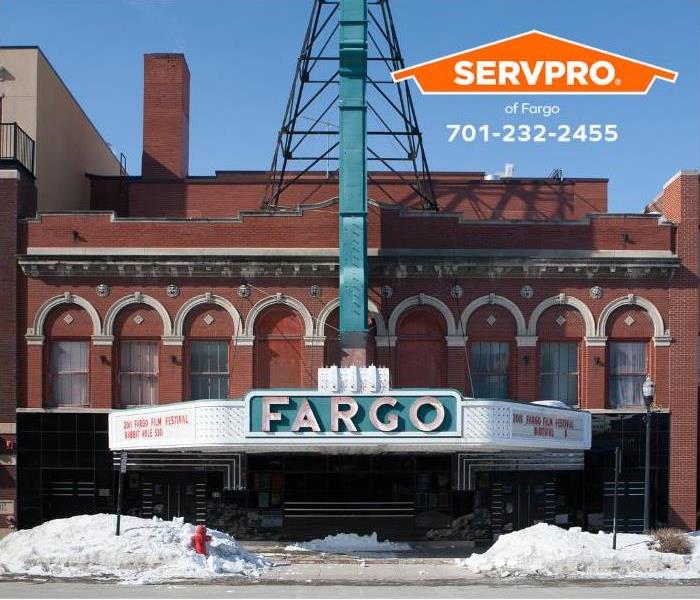 A picture of the historic Fargo Theatre in downtown Fargo, North Dakota, with snow. 