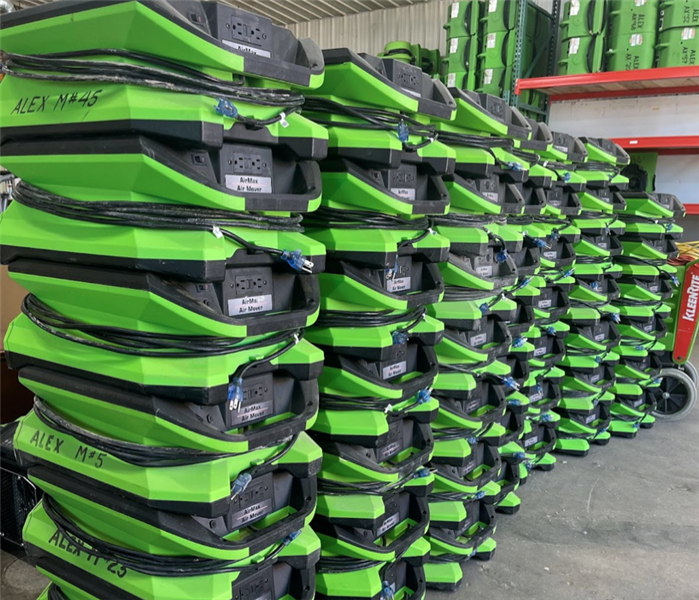 Servpro equipment piled high for a water job