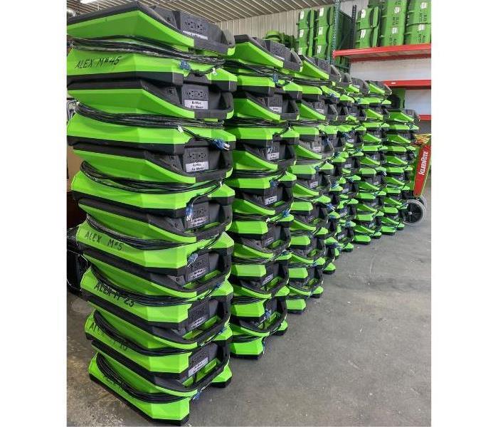 Air movers stacked up ready to go to a commercial job site
